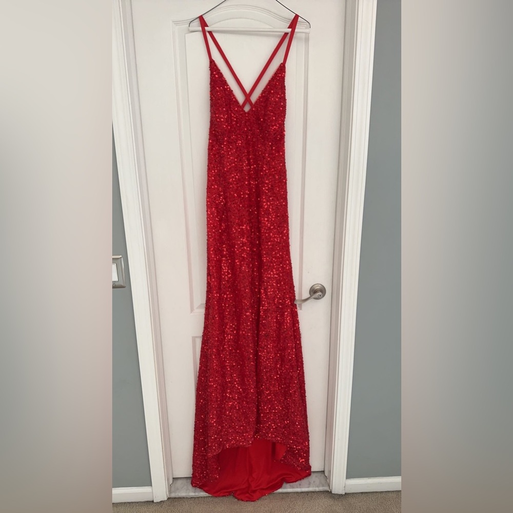 Long red prom dress, with a train and slit on the left leg. Never worn